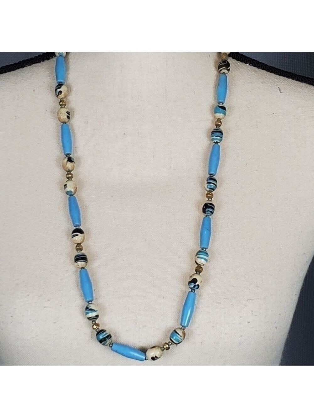 Necklace, blue, white, and black decorated beads